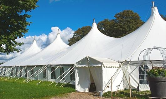 a line of portable restrooms in a shaded area, offering a comfortable experience for users in Summit Argo